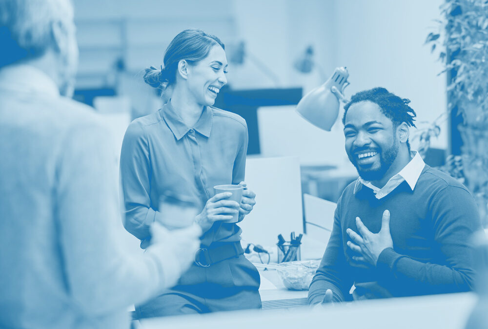 Two office workers smiling