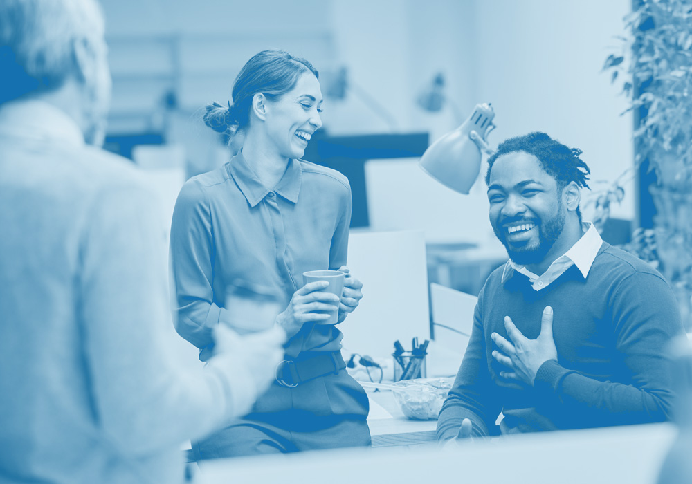 Two office workers smiling